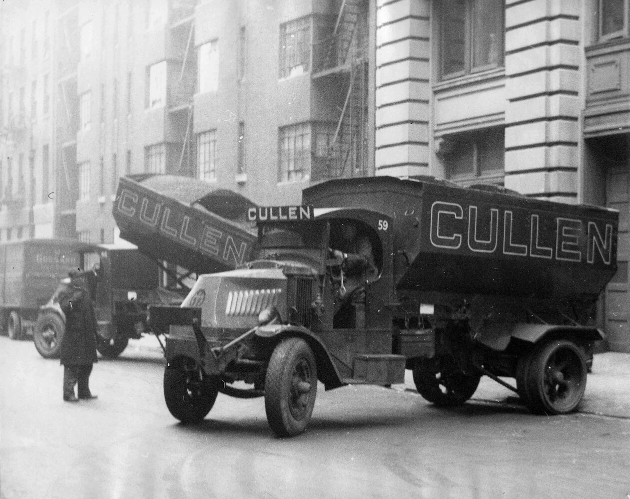 Two Tipper Trucks of the Building Co. 