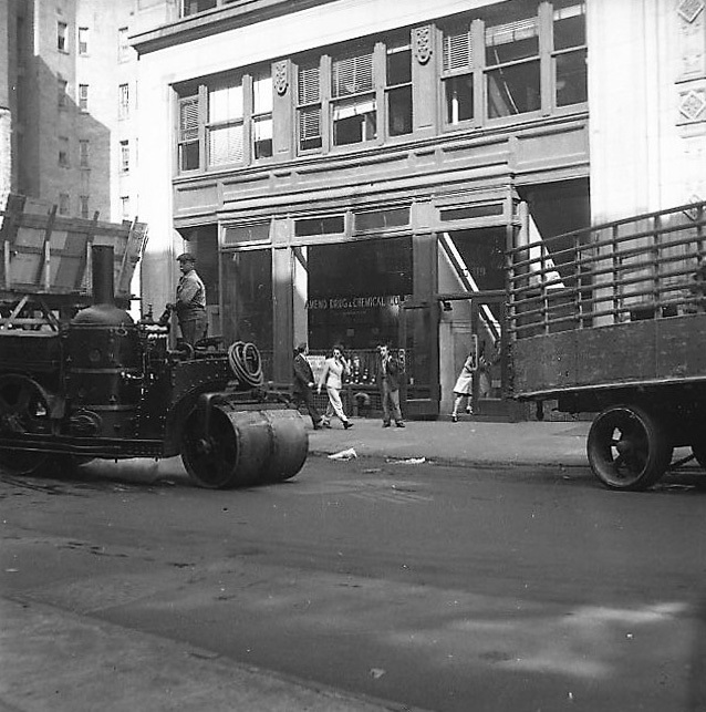 Steamroller 24th St. in front of Amend Drug & Chemical Co. II. Four Pedestrians