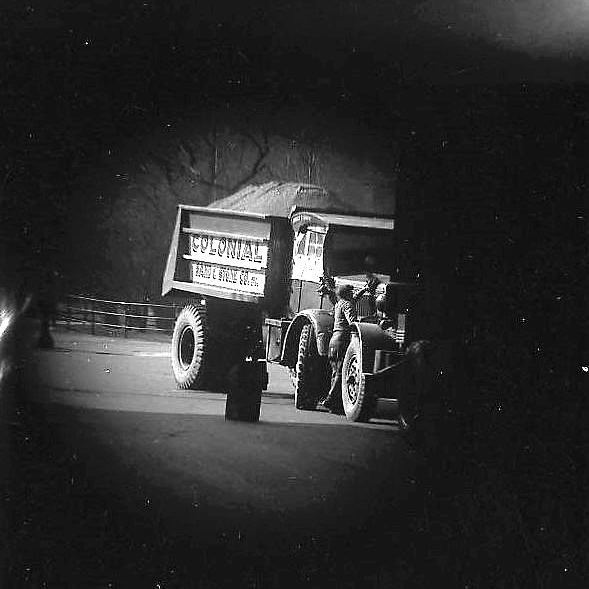 Colonial Sand and Stone Truck, photographed from within a Bus [Telescope view]
