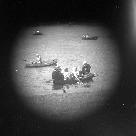 Central Park Lake. Rowing boat, Navy Sailors and Pigeon [Telescope view]
