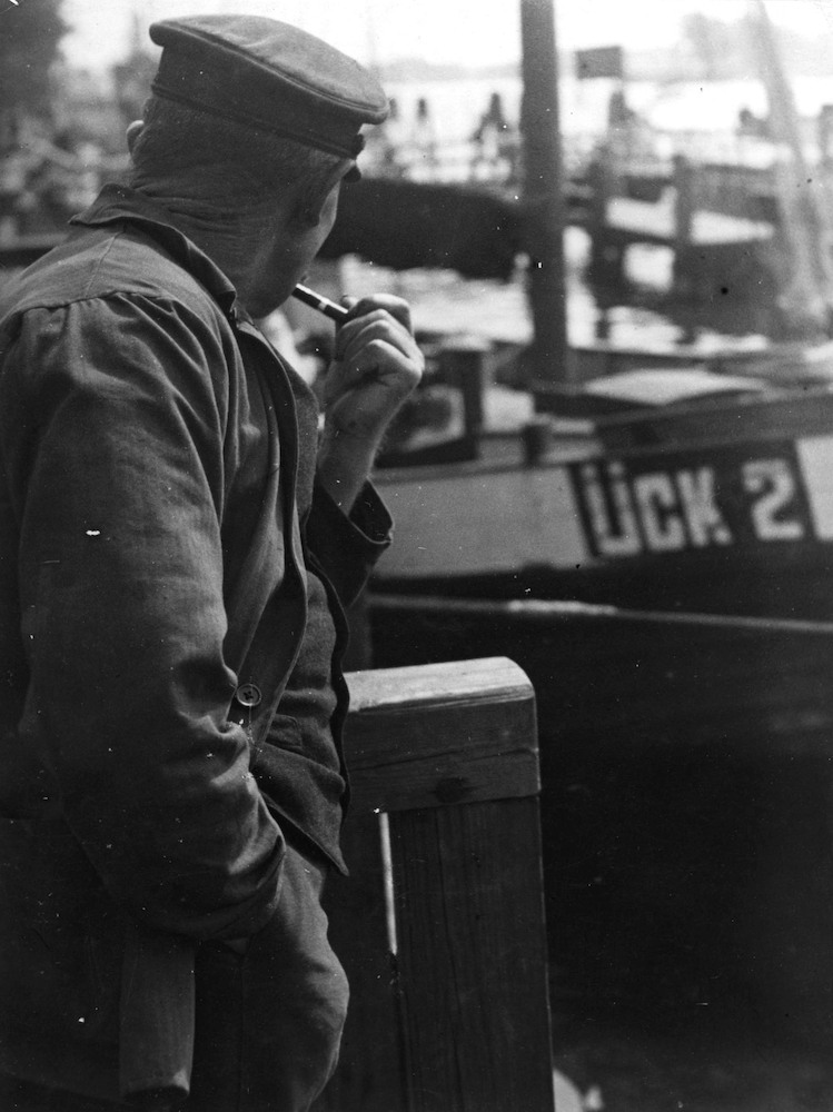Fisherman smoking in front of 