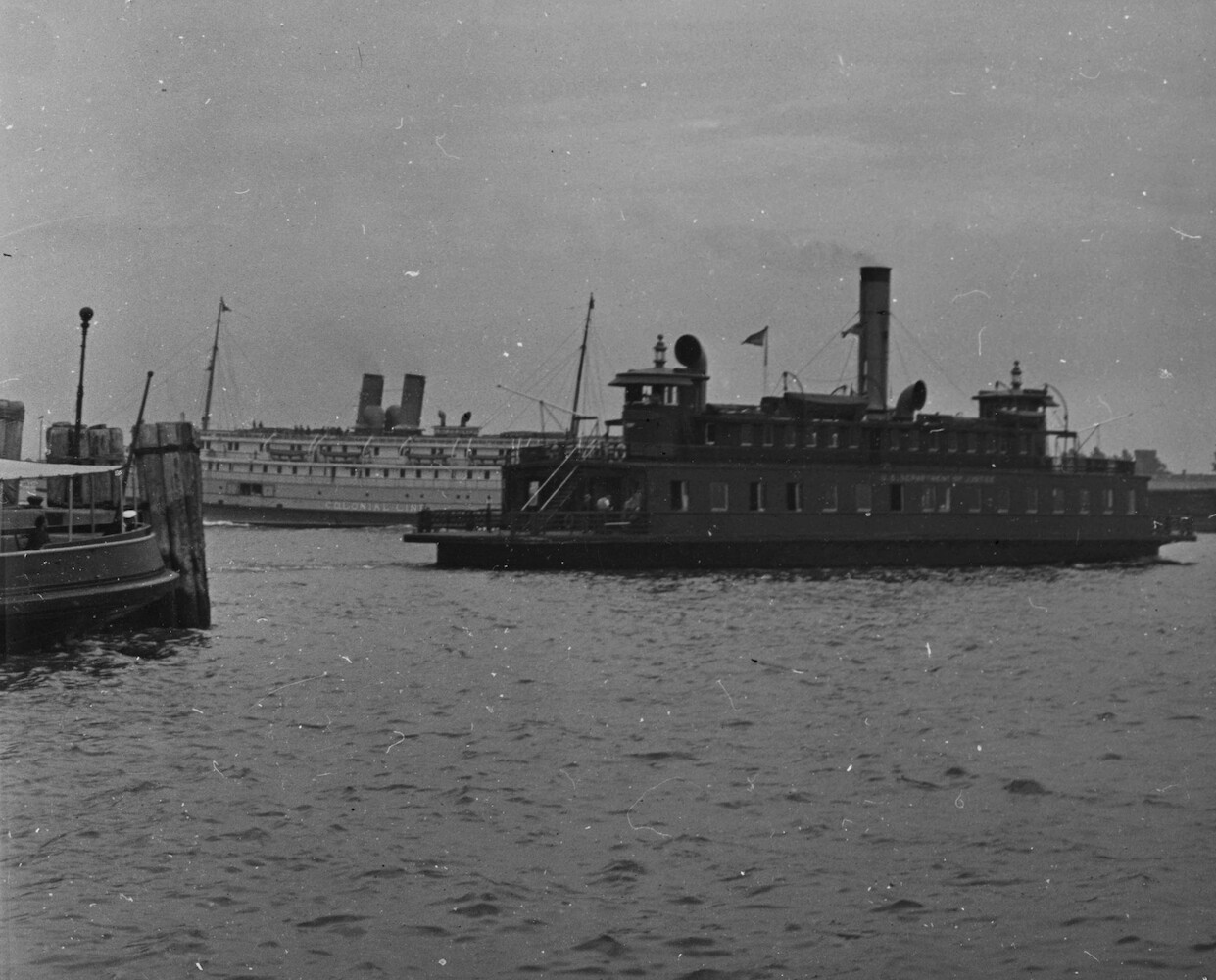 Ferry to Ellis Island, beyond the  Colonial Line Steamer East Bound