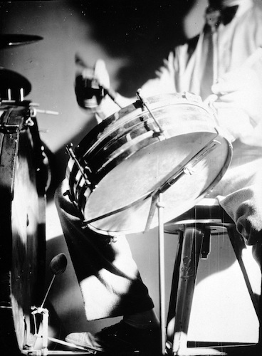 Roman Clemens playing drums, view of foot on pedal of bass drum