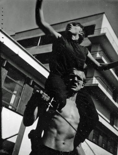Impromptu comedy I. Georg Hartmann with Karla Grosch on his shoulders outside the Bauhaus