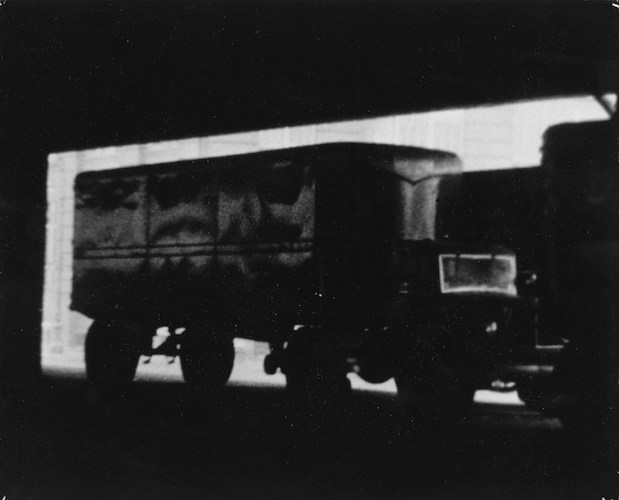 Trucks parked beneath Westside Highway (Truck and trailer on West St., N.Y.)