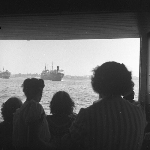 Aboard the Staten Island Ferry. Two Victory ships anchored in the Narrows