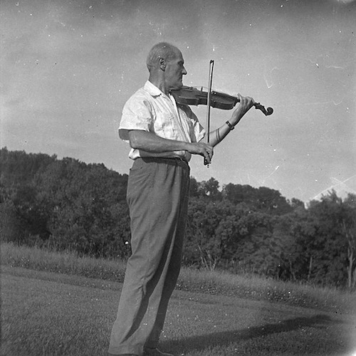 Lyonel Feininger playing the Violin outdoors