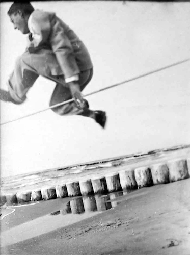 Laurence Feininger in his Sunday Best executing a High-Jump on the Beach in Deep I