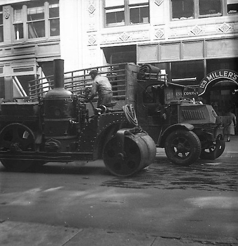 Steamroller 24th St. in front of Amend Drug & Chemical Co. IV. 123 Miller's